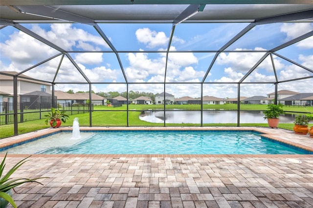 view of swimming pool featuring a water view, a yard, a lanai, and a patio