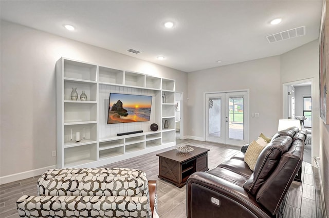 living room featuring french doors and wood-type flooring