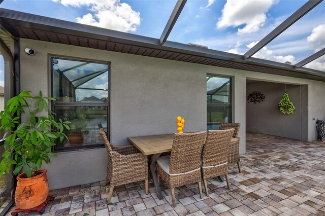 view of patio / terrace with glass enclosure