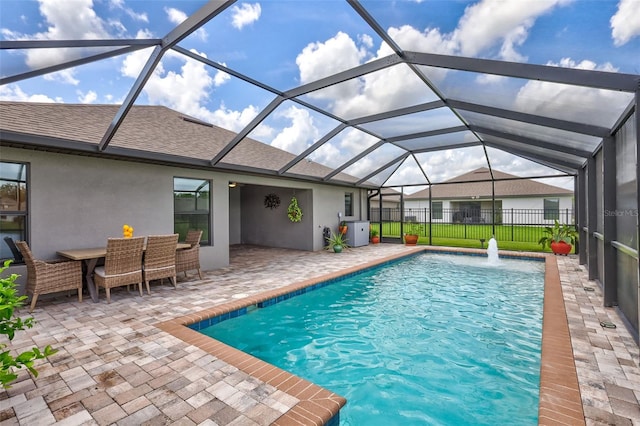 view of swimming pool with a yard, a lanai, and a patio