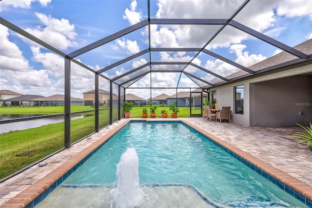 view of pool featuring a water view, a lawn, a patio area, and glass enclosure