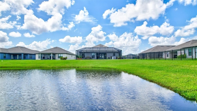 property view of water with fence and a residential view