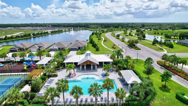 birds eye view of property with a water view