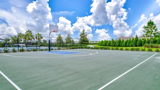 view of basketball court featuring community basketball court and fence