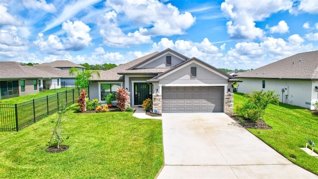 view of front facade with driveway, an attached garage, a front yard, and fence