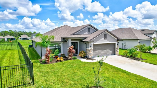 view of front of property with a garage and a front yard