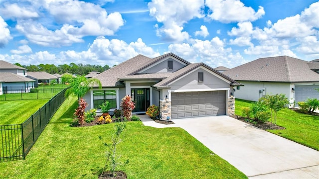 view of front of home with stucco siding, driveway, a front lawn, fence, and a garage