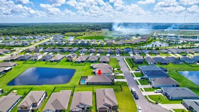 drone / aerial view featuring a water view