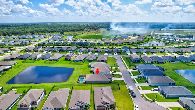 aerial view featuring a residential view and a water view