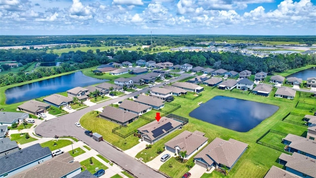 bird's eye view with a residential view and a water view