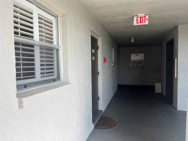 hallway with concrete flooring