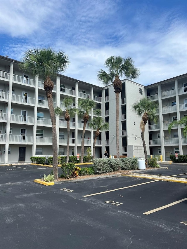 view of property with uncovered parking