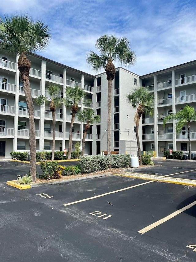 view of property with uncovered parking
