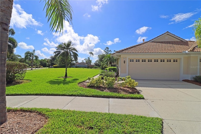 exterior space with a lawn and a garage