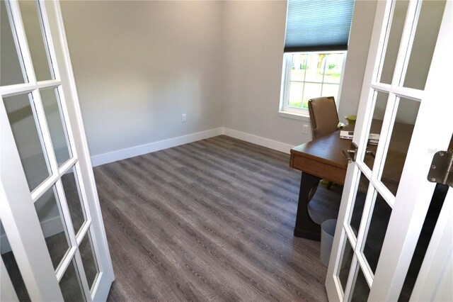 unfurnished office featuring dark hardwood / wood-style floors