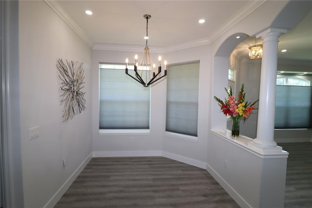 5107 Whispering Oaks Dr, North Port, FL 34287 - unfurnished dining area with an inviting chandelier, dark wood-type flooring, ornate columns, and ornamental molding