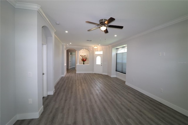 5107 Whispering Oaks Dr, North Port, FL 34287 - unfurnished living room with crown molding, ceiling fan, arched walkways, baseboards, and wood finished floors
