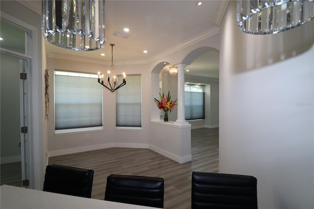 5107 Whispering Oaks Dr, North Port, FL 34287 - unfurnished dining area with decorative columns, visible vents, arched walkways, wood finished floors, and a chandelier