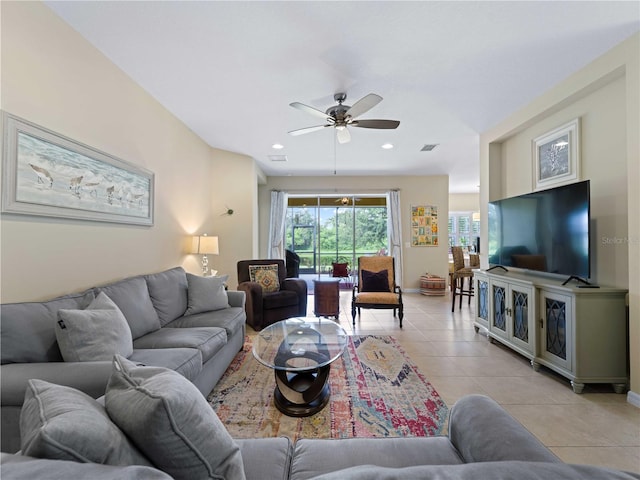 tiled living room featuring ceiling fan