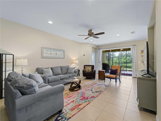 tiled living room with ceiling fan