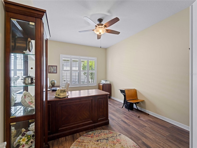 office space featuring ceiling fan and dark hardwood / wood-style floors