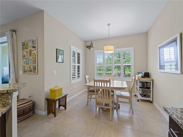 dining room featuring light tile patterned flooring