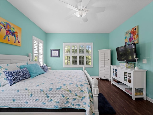 bedroom with ceiling fan and dark wood-type flooring