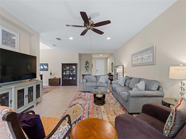 tiled living room with ceiling fan