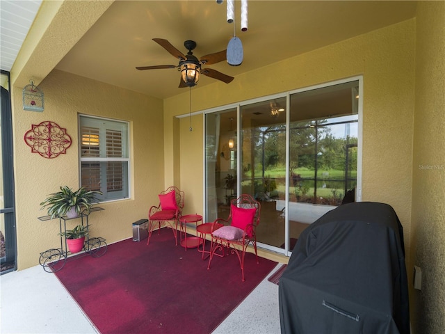 view of patio with a grill and ceiling fan