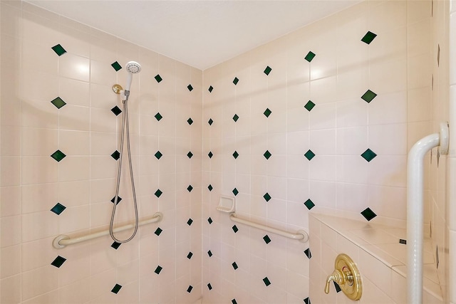 bathroom with tiled shower