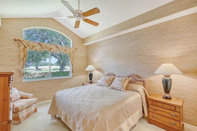 bedroom with ceiling fan and high vaulted ceiling