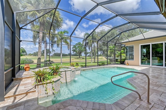 view of swimming pool featuring an in ground hot tub, pool water feature, glass enclosure, and a patio area