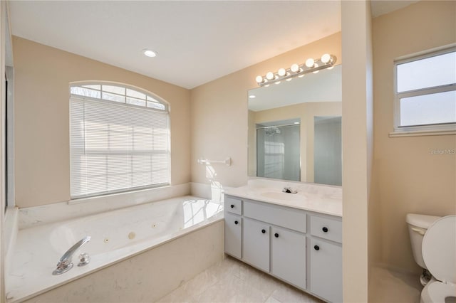 full bathroom featuring independent shower and bath, vanity, and toilet