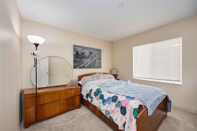 bedroom with light colored carpet