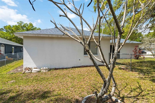 view of side of property with a yard