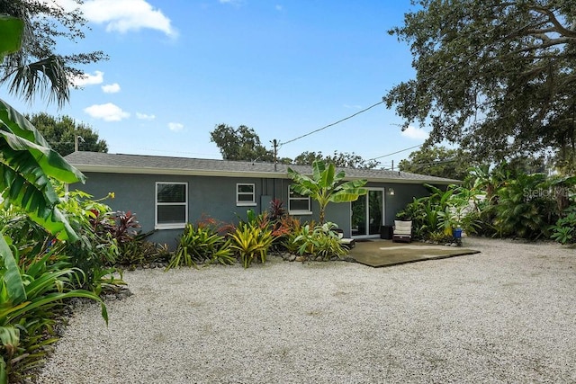 rear view of house with a patio