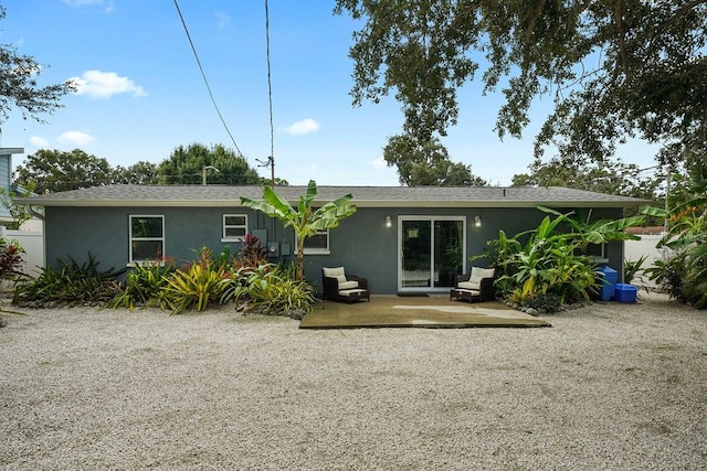 back of house featuring a patio area