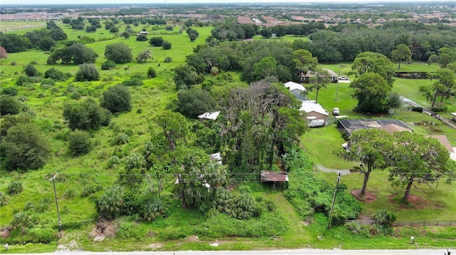 birds eye view of property with a rural view