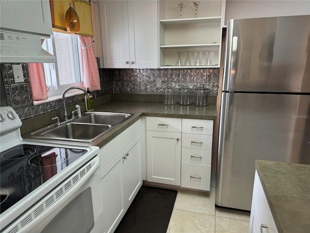 kitchen with stainless steel refrigerator, range hood, white electric stove, and white cabinets