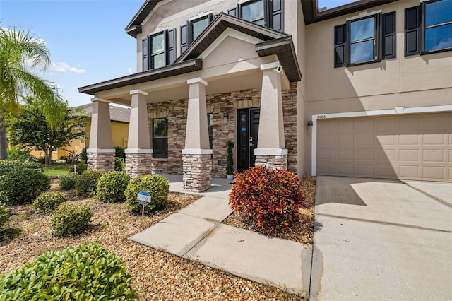 property entrance featuring a garage and a porch