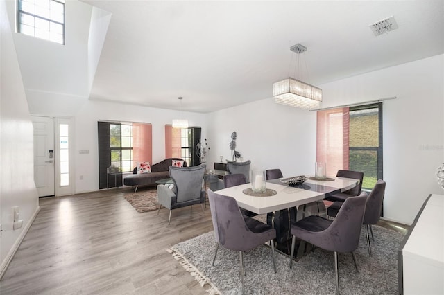 dining area featuring a chandelier and hardwood / wood-style floors