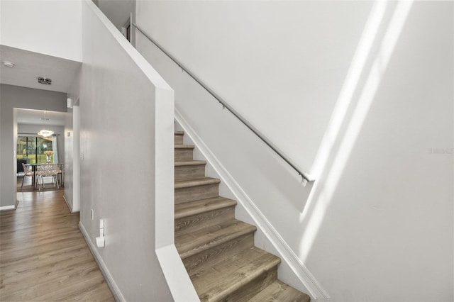 stairs with wood-type flooring