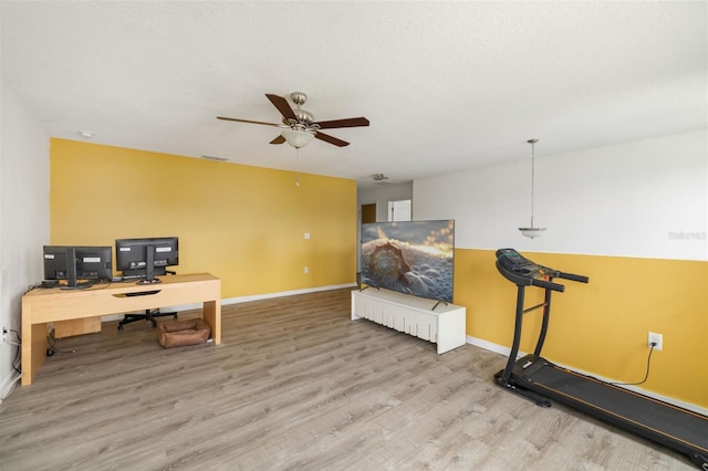 office space featuring light hardwood / wood-style flooring and ceiling fan