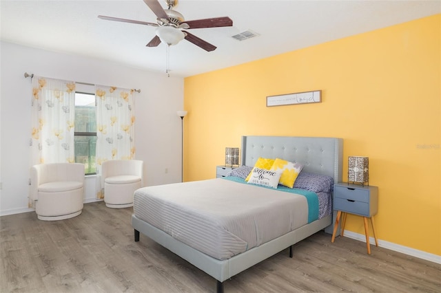 bedroom featuring ceiling fan and light hardwood / wood-style floors