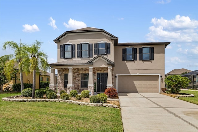 view of front of house featuring a front lawn and a garage