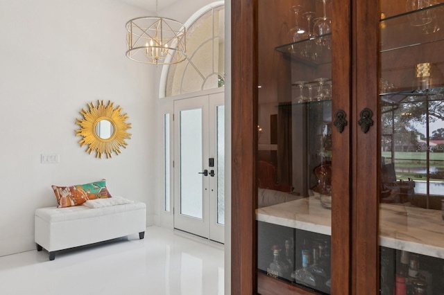 interior space with a chandelier and wine cooler