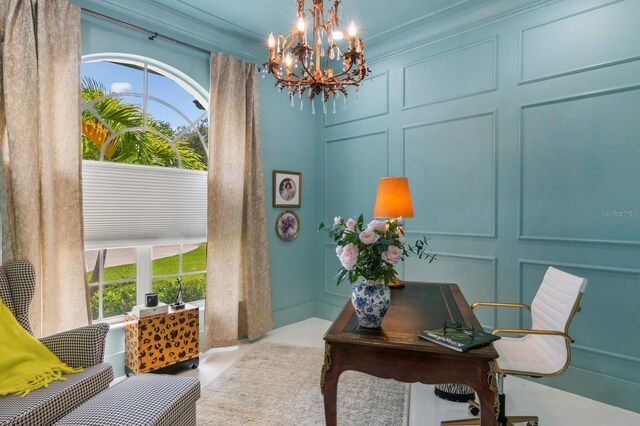 office space featuring crown molding and an inviting chandelier