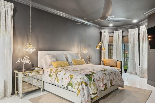 bedroom with ornamental molding and ceiling fan with notable chandelier