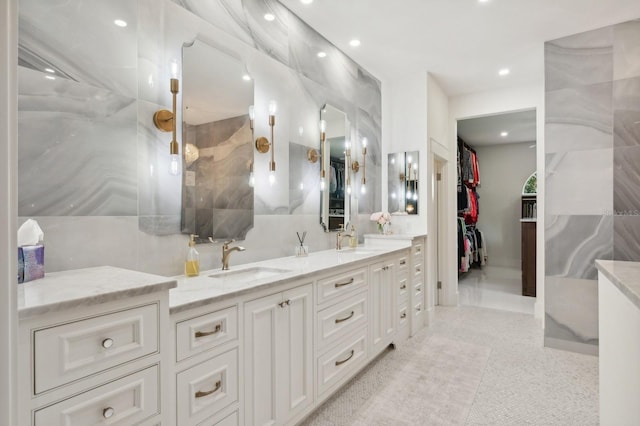 bathroom with tile patterned flooring and vanity