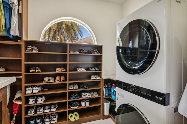 laundry room with stacked washer and dryer